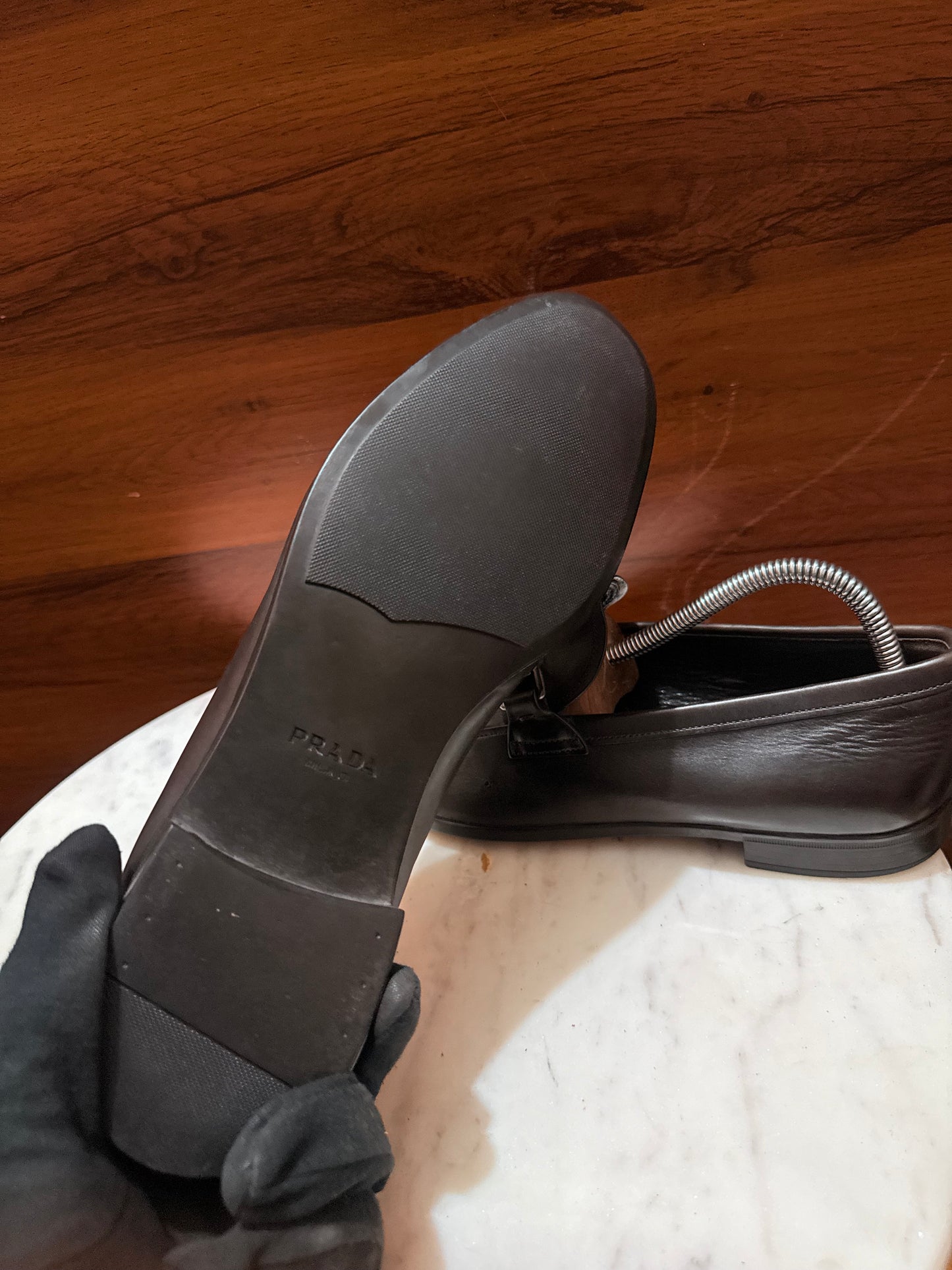 Prada Engraved Logo Bit Leather Loafers