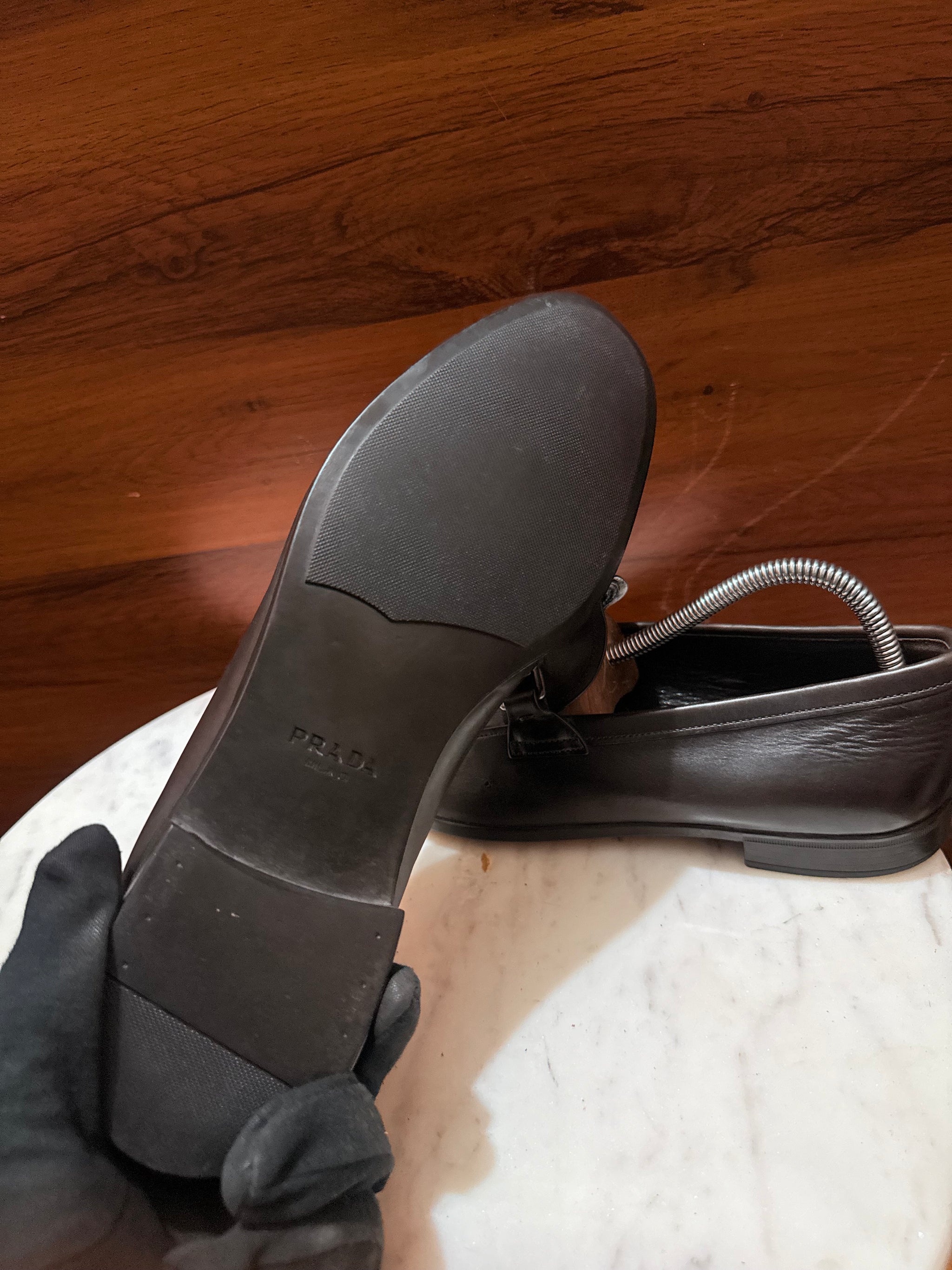 Prada Engraved Logo Bit Leather Loafers