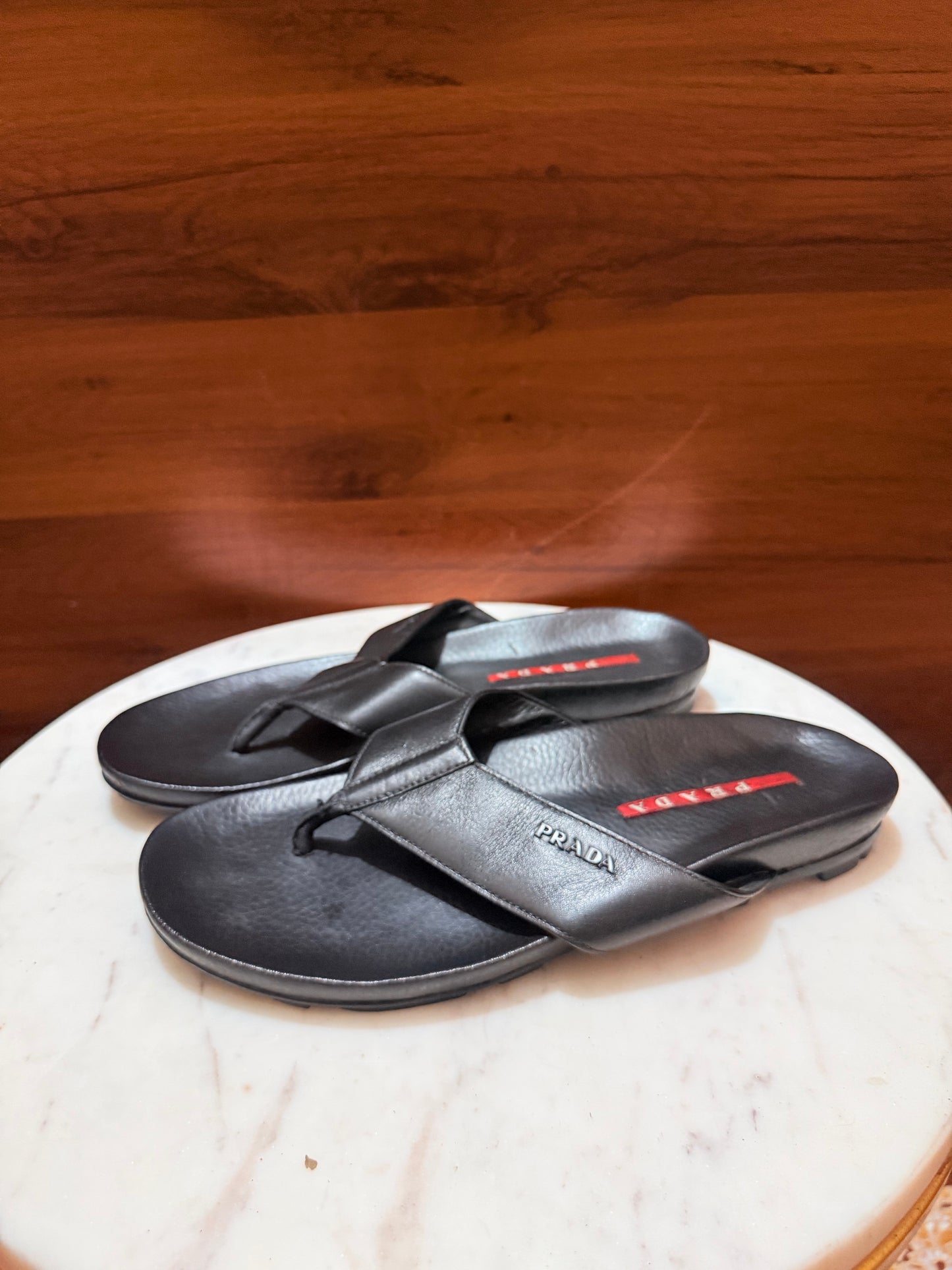 Prada Linea Rossa Metal Logo Leather Flip-Flop Sandals