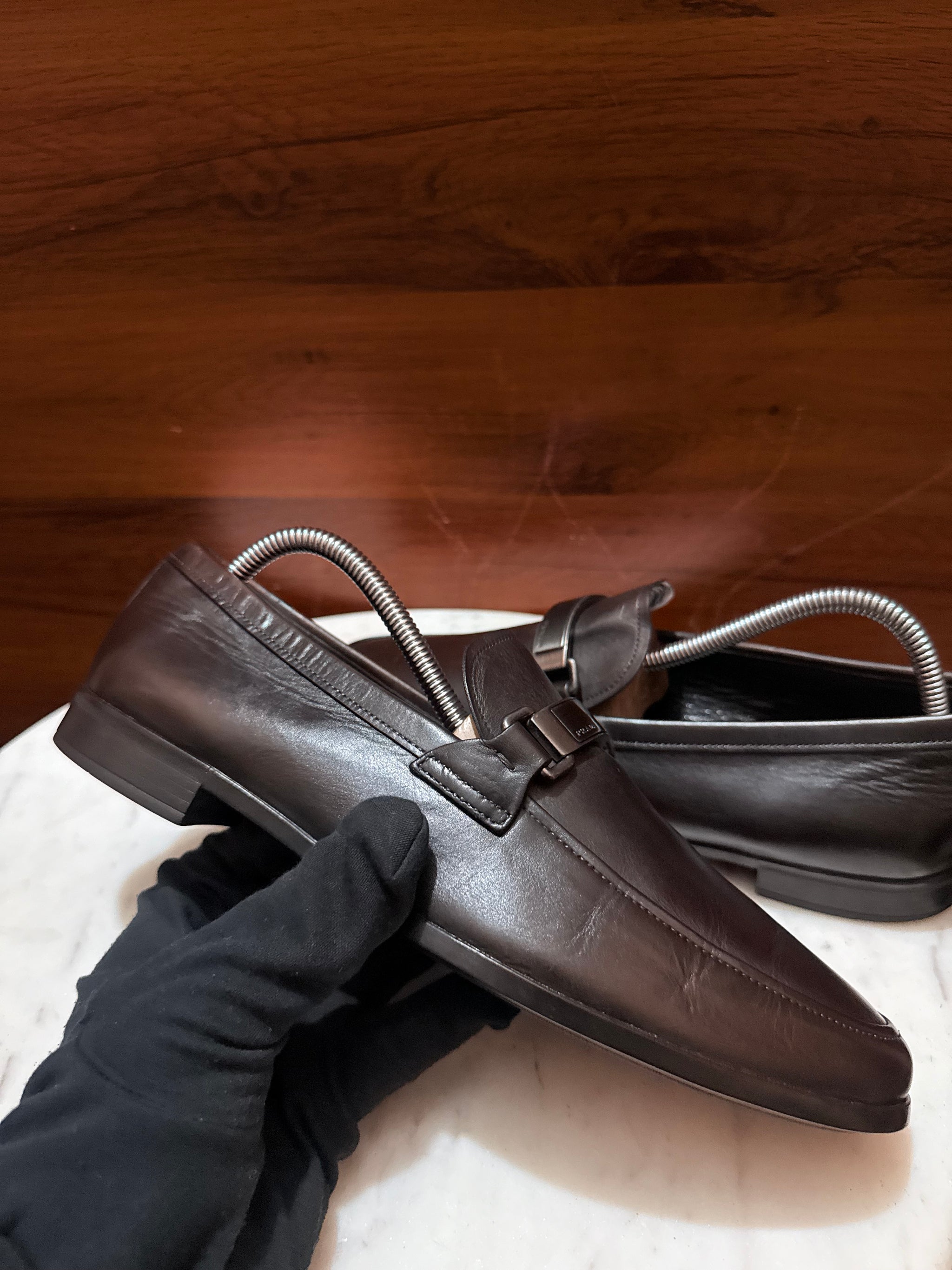 Prada Engraved Logo Bit Leather Loafers