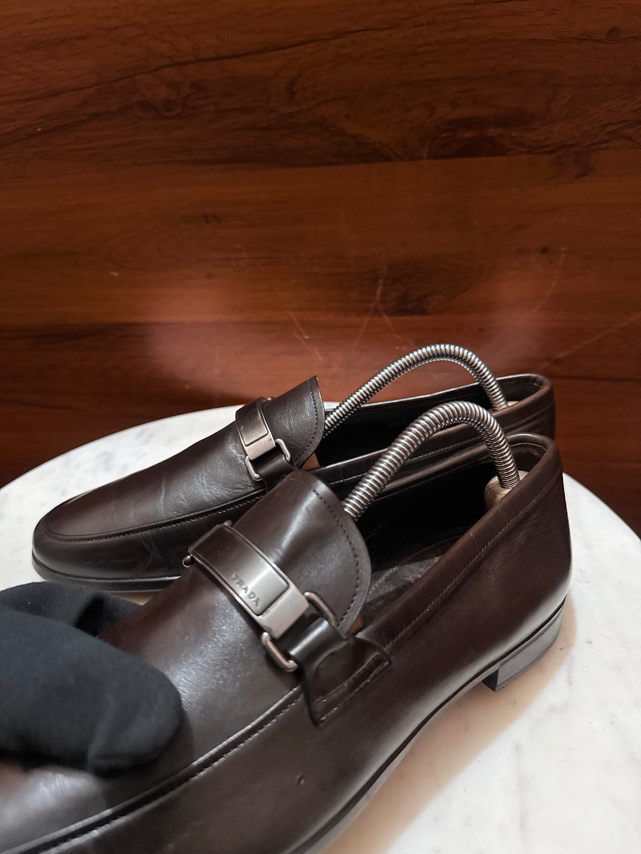 Prada Engraved Logo Bit Leather Loafers