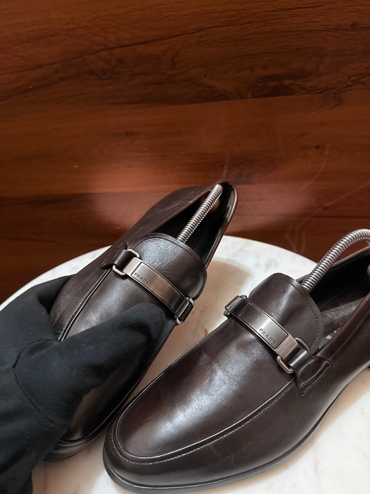 Prada Engraved Logo Bit Leather Loafers