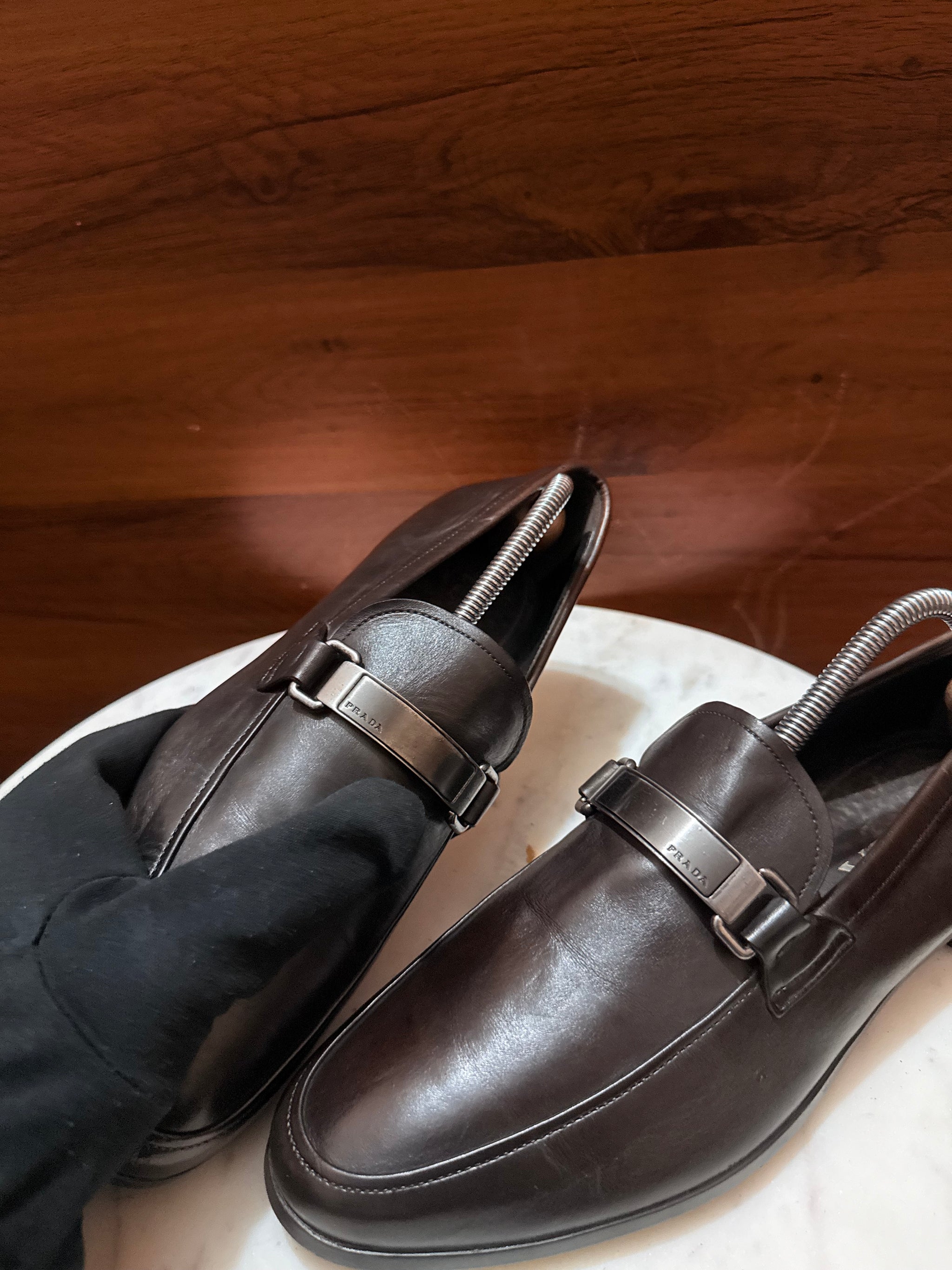 Prada Engraved Logo Bit Leather Loafers